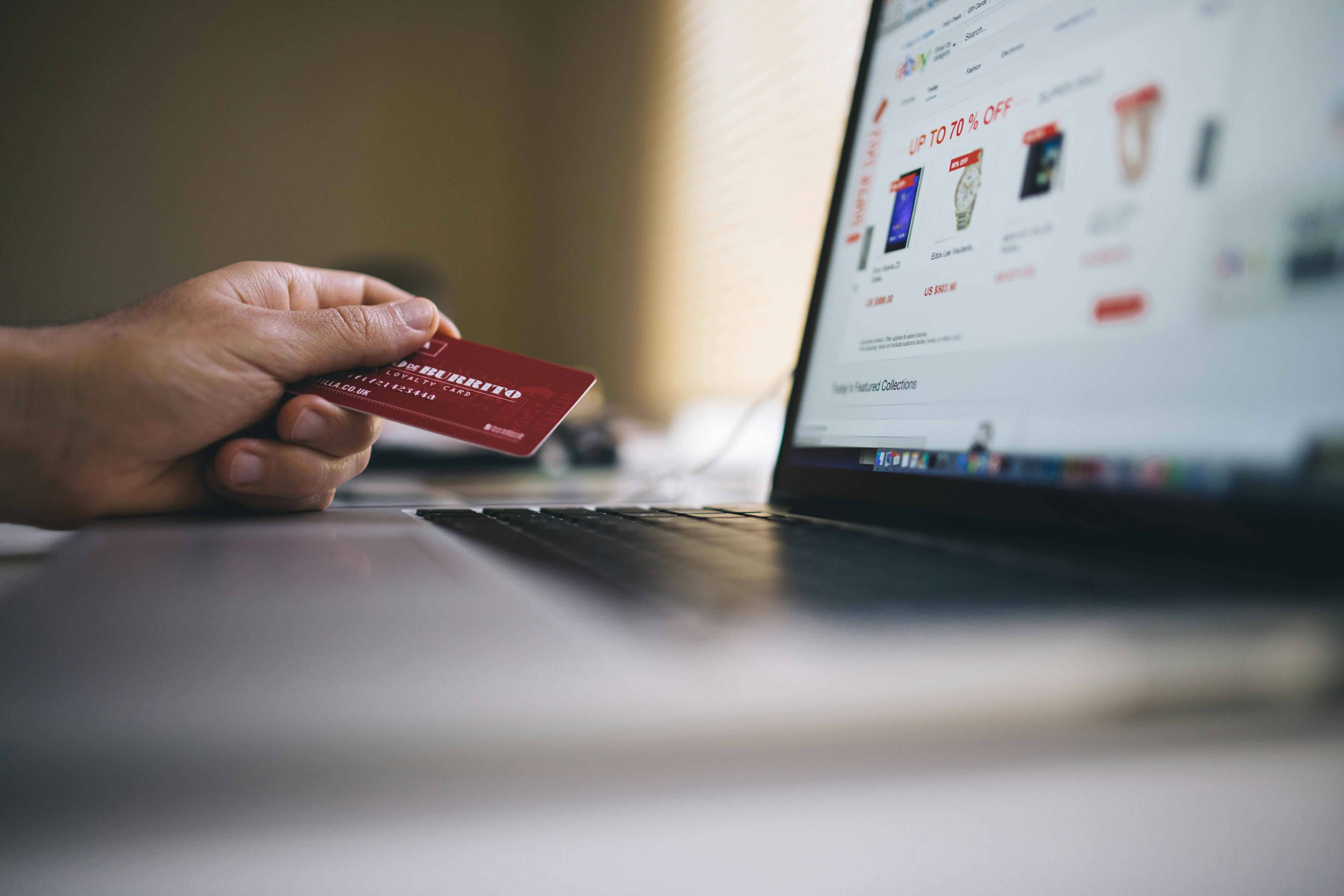 A person shopping online on a laptop
